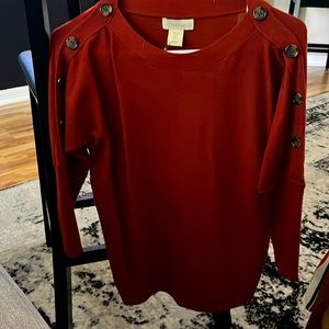 Cynthia Rowley light weight sweater with rounded sides and buttons down arm.
